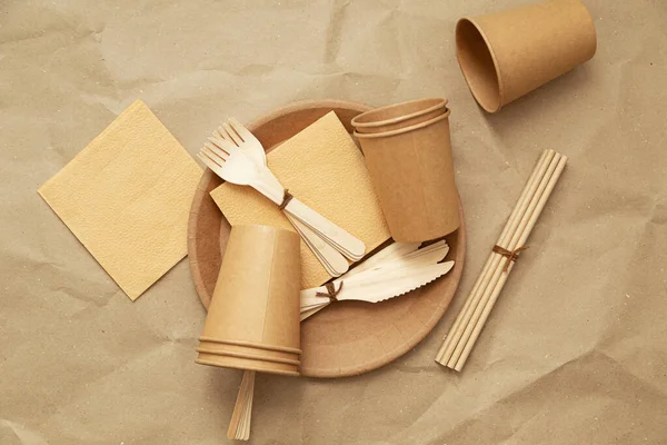 Natural environmentally friendly bamboo and paper tableware. The concept of recycling, nature conservation and saving the earth.