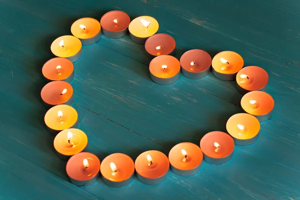 The Heart Of The Candles On A Blue Background — Stock Photo, Image