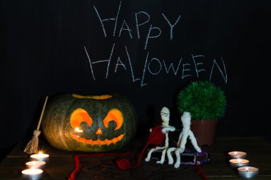 Toy mummies and jack-o'-lantern. clipart