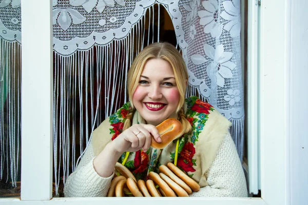 Young beautiful woman with bagels. — Stock Photo, Image