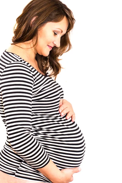 Gravid kvinna som håller i magen. — Stockfoto