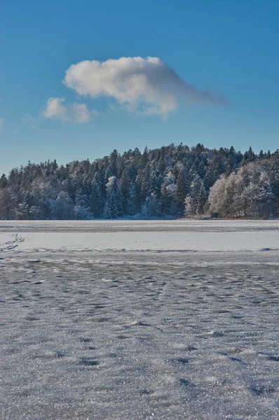 Frozen lake in the mountains. Frozen mountain lake in the german alps.