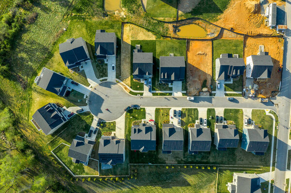 Top down aerial view of an oval shaped cul-de-sac luxury real estate neighborhood in the USA