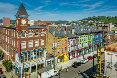Aerial view of colorful Findlay market in the re-gentrified Over the Rhine neighborhood of Cincinnati Ohio USA with street vendors clipart