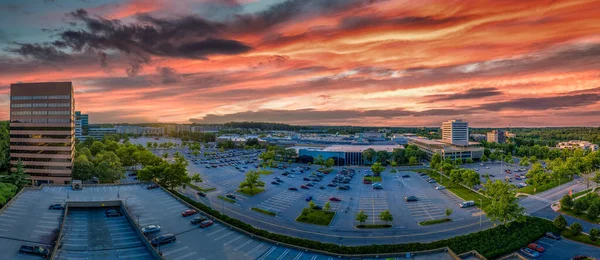 Aerial panorama of Columbia Town Center in Maryland new Washington DC with office buildings and the Columbia Mall with dramatic sunset sky