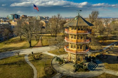 Patterson Park Pagoda During Winter in Baltimore, Maryland, USA with American Flag clipart