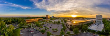 Aerial sunset panorama of Columbia Town Center in Maryland new Washington DC with office buildings and the Columbia Mall clipart