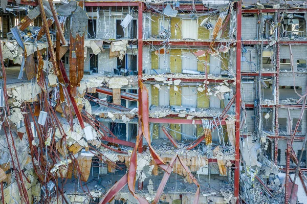 Aerial view of an office building under demolition by a wrecking ball in Columbia Town Center  Maryland new Washington DC