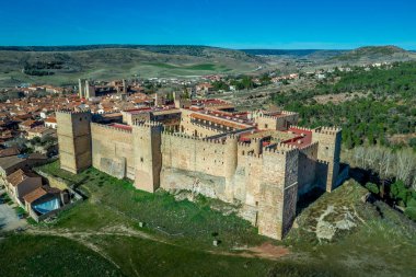 Siguenza aerial panorama of castle and town with blue sky in Spain clipart