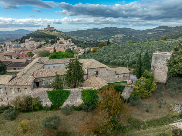 An aerial view of Assisi Rocca Minore and Maggiore, medieval town with city walls in Umbria Italy