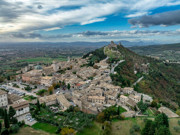 An aerial view of Assisi Rocca Minore and Maggiore, medieval town with city walls in Umbria Italy