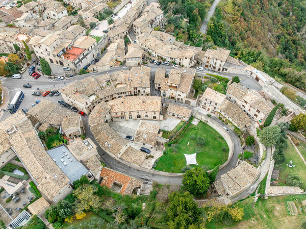 Aerial view of the Roman Amphitheater turned into a medieval neighborhood in Assisi Umbria Italy