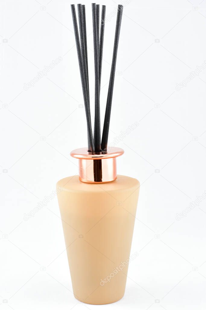 Home scents with sticks, light brown bottle, clean and fresh air