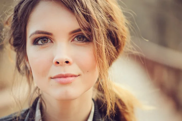 Autumn outdoor portrait of young beautiful woman with natural makeup in leather jacket and plaid shirt, soft vintage toned — Stock Photo, Image