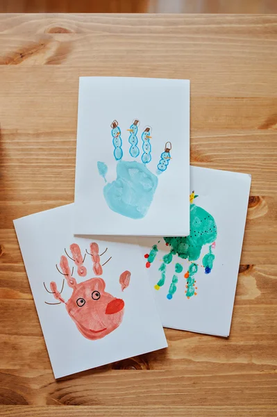 Handmade christmas handprints post cards with deer, snowman and tree — Stock Photo, Image