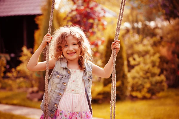 Child girl relaxing on swing — Stock Photo, Image