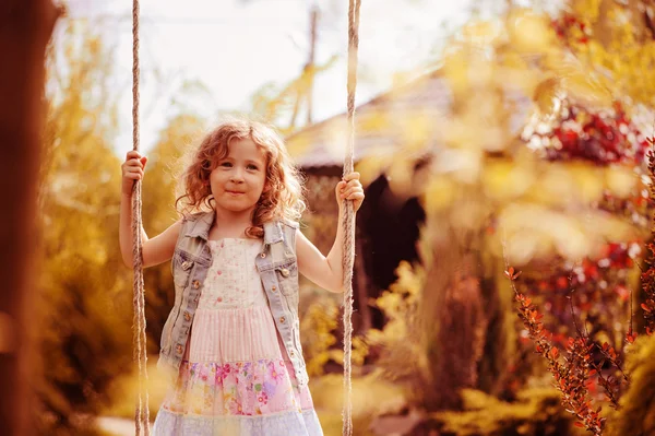 Child girl relaxing on swing — Stock Photo, Image