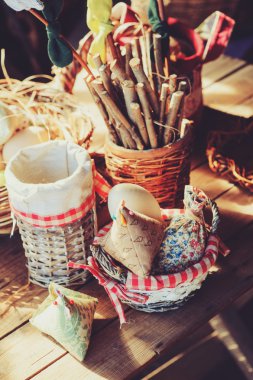 bird feeder with seeds on wooden table in cozy country house, vintage toned, selective focus
