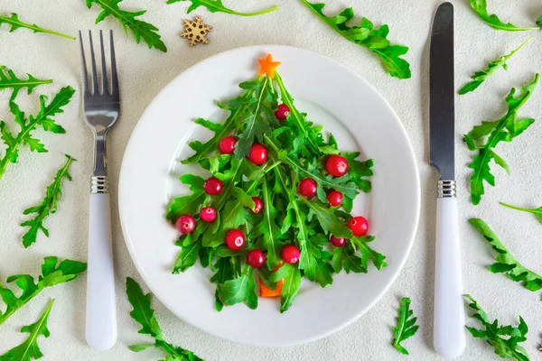 The Christmas tree arugula salad on white plate. Flat lay — Stock Photo, Image