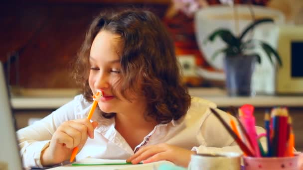 Curly schoolgirl studying at home. social distance during quarantine, self-isolation — Stock Video