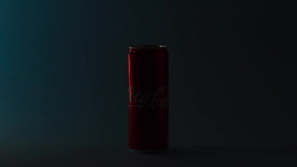 UKRAINE, KIEV - SEPTEMBER 02, 2021: Glass of Coca-Cola with ice, can and bottle of Coca-Cola on blue background — Stock Video