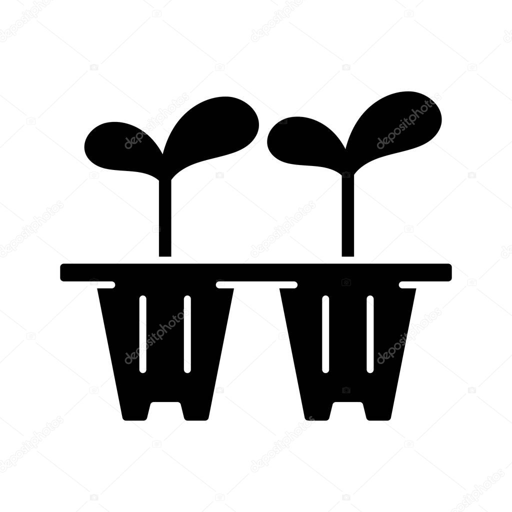 Seedling trays black glyph icon. Temporary containers that hold plants from seed to seedling stage. Seeds are transferred from trays. Silhouette symbol on white space. Vector isolated illustration