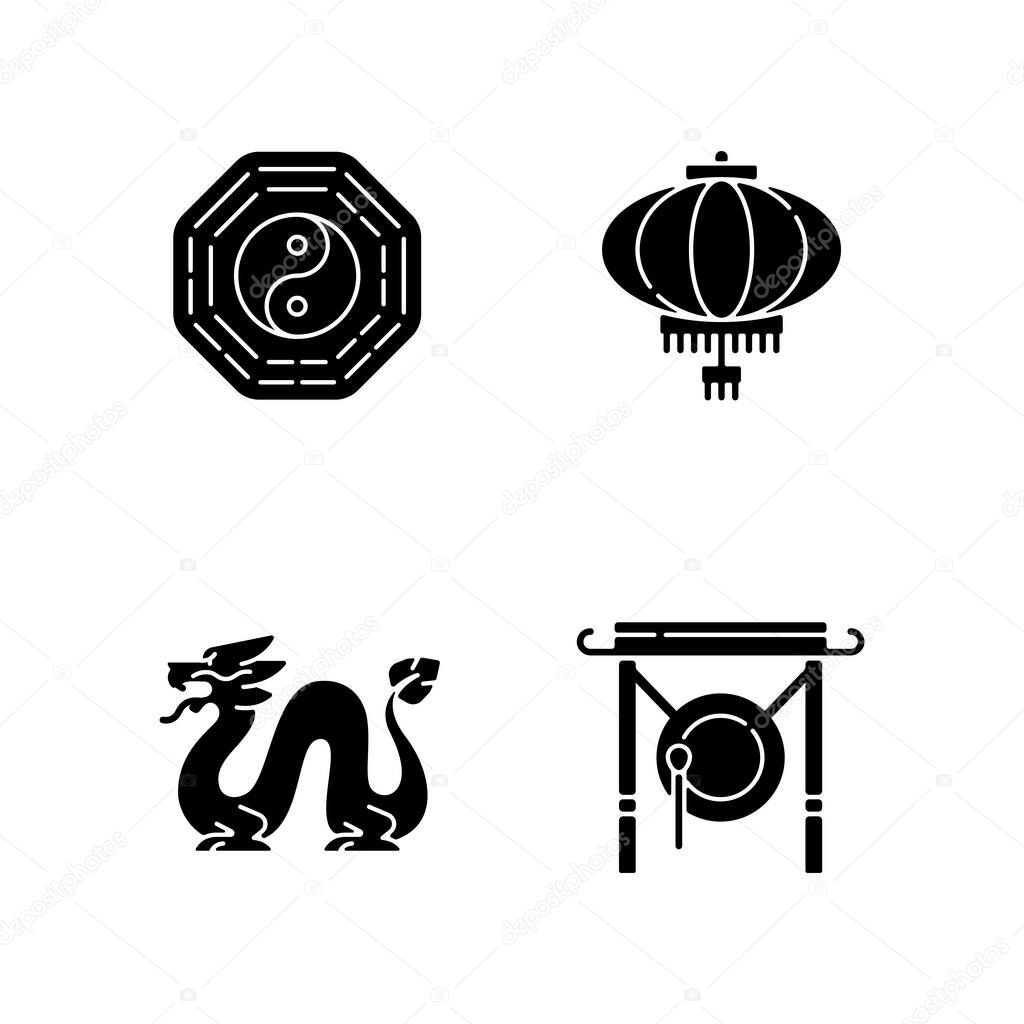Lunar New Year attributes black glyph icons set on white space. Bagua, feng shui. Paper lantern. Loong dragon. Chinese gong. Oriental culture. Silhouette symbols. Vector isolated illustration