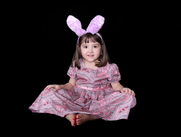 Sweet little girl in bunny ears at easter isolated — Stock Photo, Image