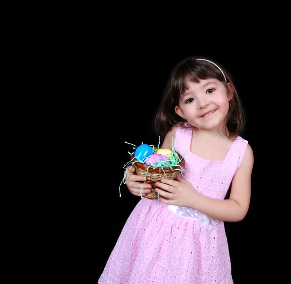 Sweet young girl holding easter eggs isolated — Stock Photo, Image