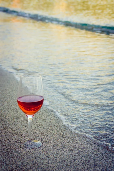 Romantic glass of wine sitting on the beach at colorful sunset, Glass ...