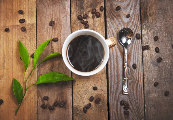 Kaffe på en trä bakgrund — Stockfoto