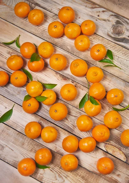 Tangerines on a wooden background — Stock Photo, Image