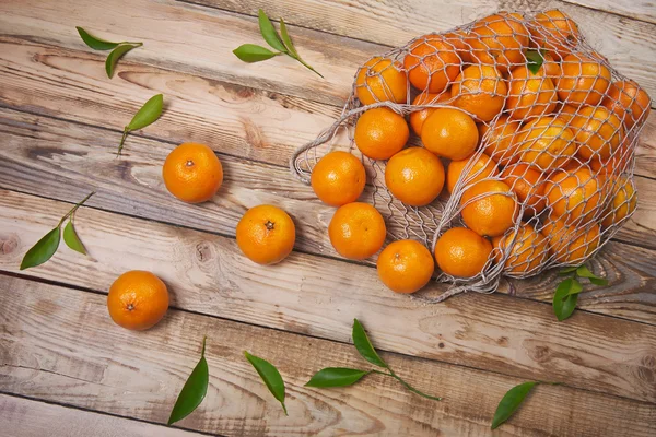 Tangerines on a wooden background — Stock Photo, Image