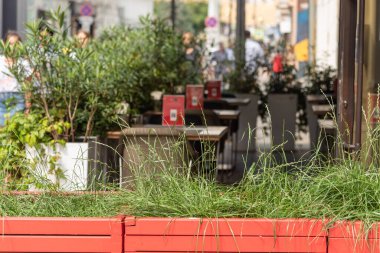 Empty tables in a summer outdoor street cafe