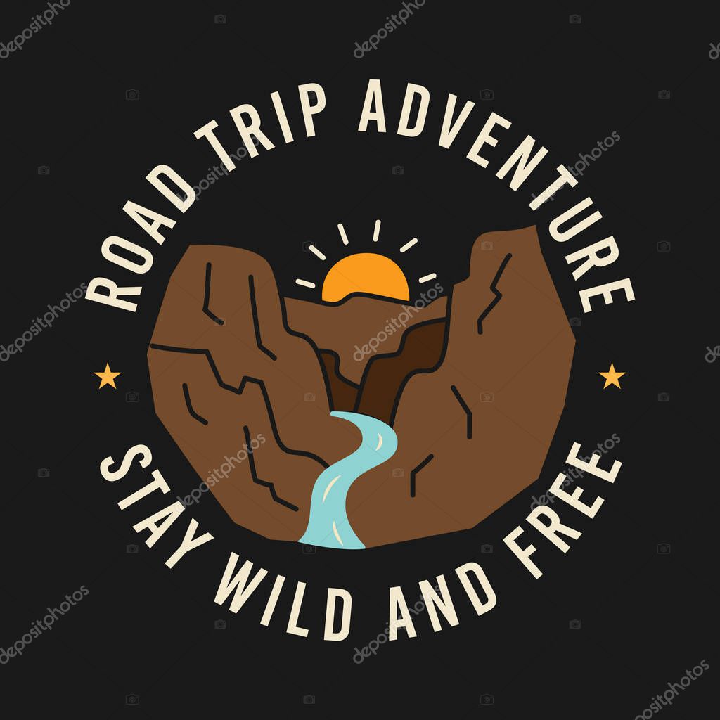 Sun rising over mountains with river amidst Road Trip Adventure and Stay Wild And Free inscriptions on t shirt design