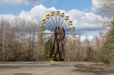 UKRAINE. Chernobyl Exclusion Zone. - 2016.03.19. Abandoned amusement park in the Pripyat city clipart