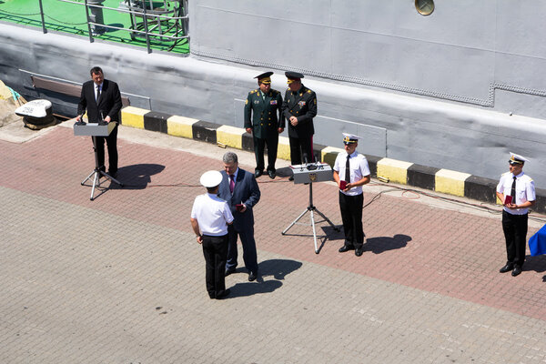 Odesa, Ukraine - July 03, 2016: President Petro Poroshenko awards sailors and soldiers on the pier the Odessa port. Navy day celebration.