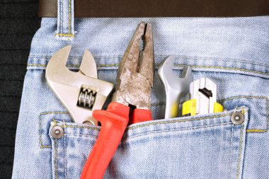 Toolkit in a blue jeans background clipart