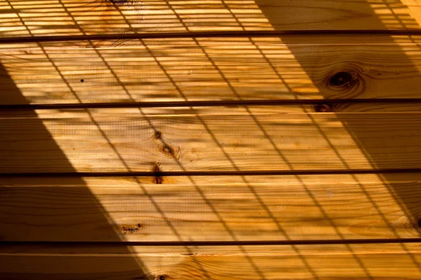 Parede de madeira fundo em uma luz da manhã — Fotografia de Stock