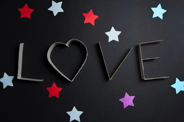 the word love made up of cardboard letters