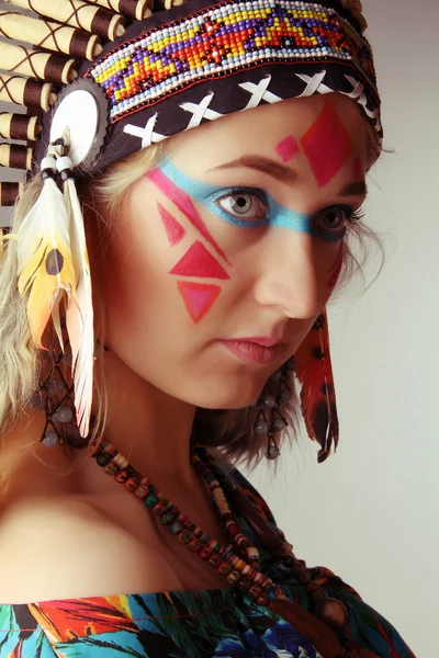 The beautiful modern young girl in the native american suit — Stock Photo, Image