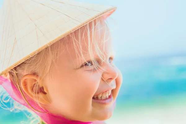 Funny face portrait of happy child in vietnamese straw hat — Stock Photo, Image