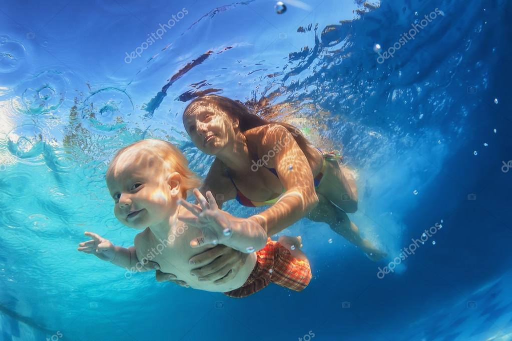 Mother with child swimming underwater in the pool Stock Photo by ©dmosreg 73531575