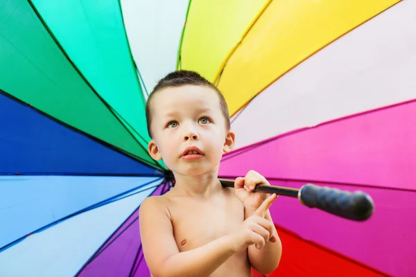 Portrait of the little boy with rainbow colors umbrella — Stock Photo, Image