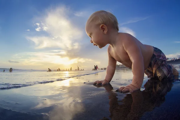Little child on sunset tropical beach — Stock Photo, Image