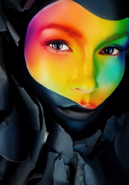 Beautiful face with colored make up. clipart