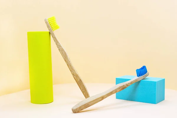 Eco Friendly Wooden Toothbrushes Natural Yellow Bristles Abstract Composition Podium — Stock Photo, Image