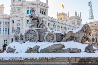 Madrid, Spain- January 9, 2021: Plaza de Cibeles in Madrid covered in snow. Filomena storm. Great snowfall in Madrid clipart