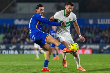 Madrid, İspanya - 28 Kasım 2025: Getafe CF ile Elche CF arasındaki lig maçı Getafe 'de oynandı. Maç sırasında Elche CF oyuncuları. EA Spor Ligi 2025.