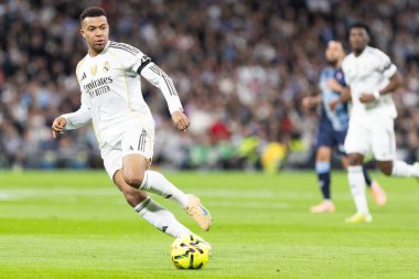 Madrid, Spain - December 7, 2025: La Liga match between Real Madrid and Celta Vigo played at the Santiago Bernabu Stadium in Madrid. Real Madrid players with the ball. Professional league. EA SPORTS